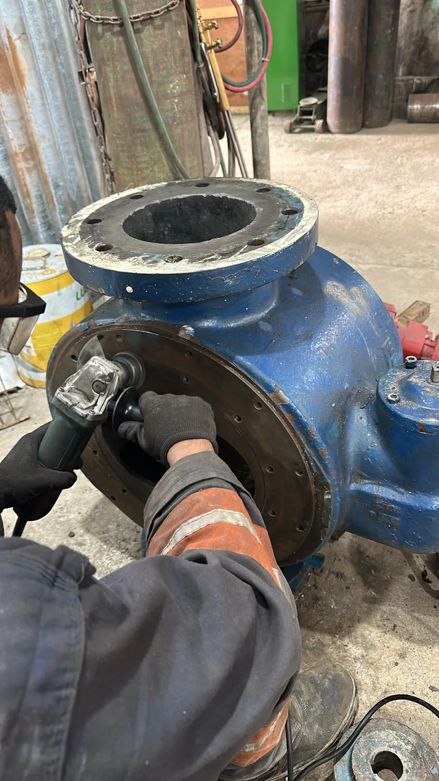 Surface preparation on an industrial pump casing