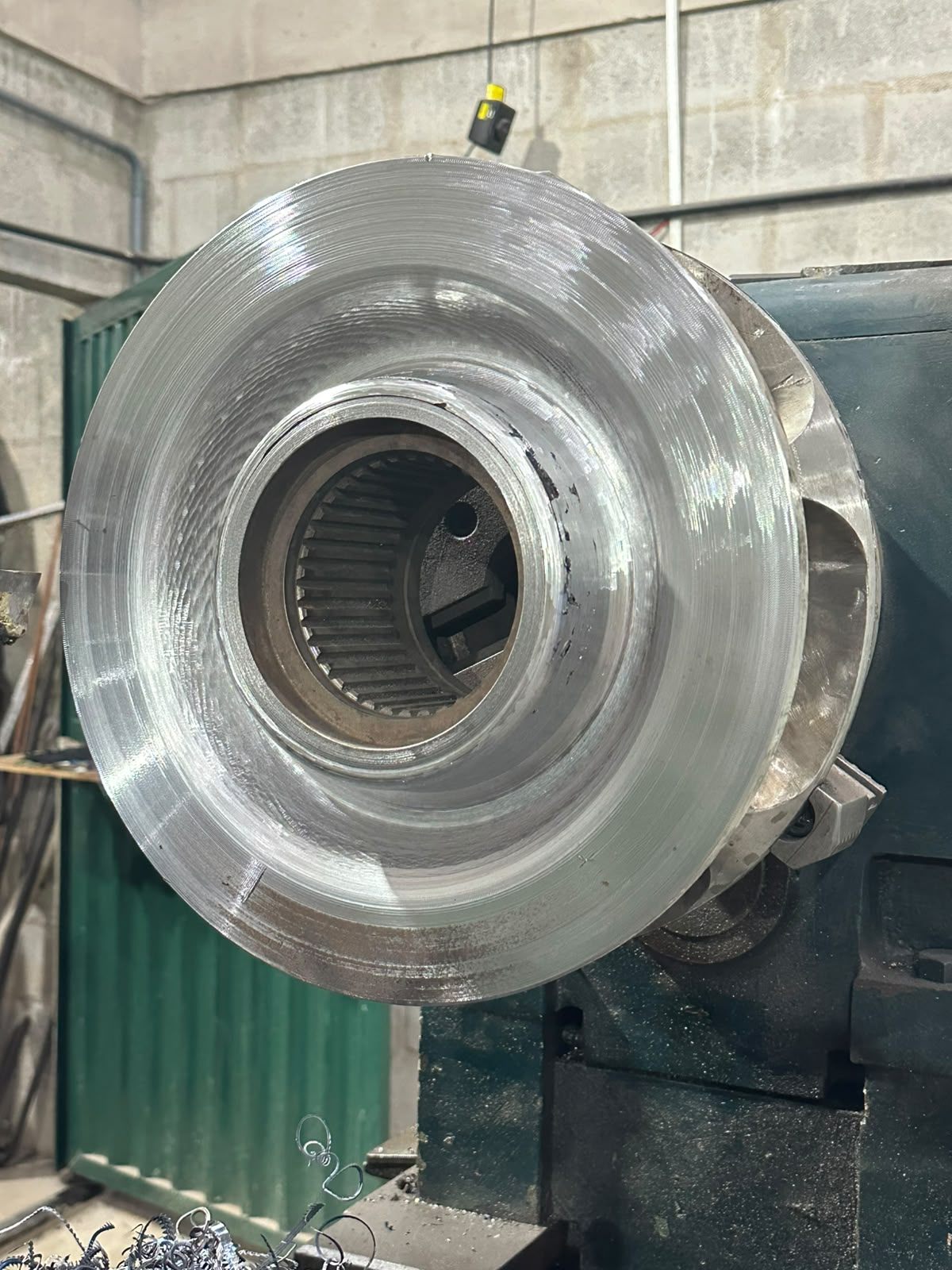 The sheave finished on the lathe, with the face machined and the internal splines in view